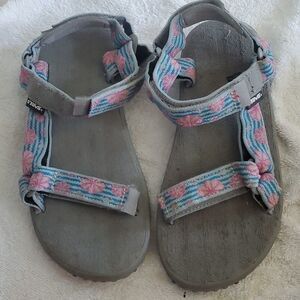 Classic teva sandals with Velcro straps.
